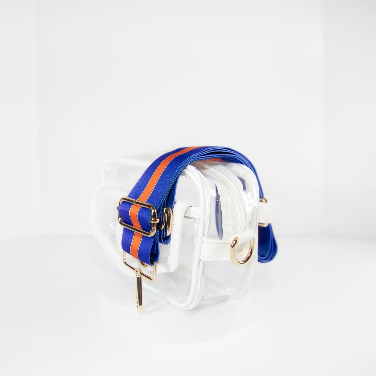 Clear stadium bag in white leather trim, side facing, with a crossbody strap in University of Florida Gators team colors.