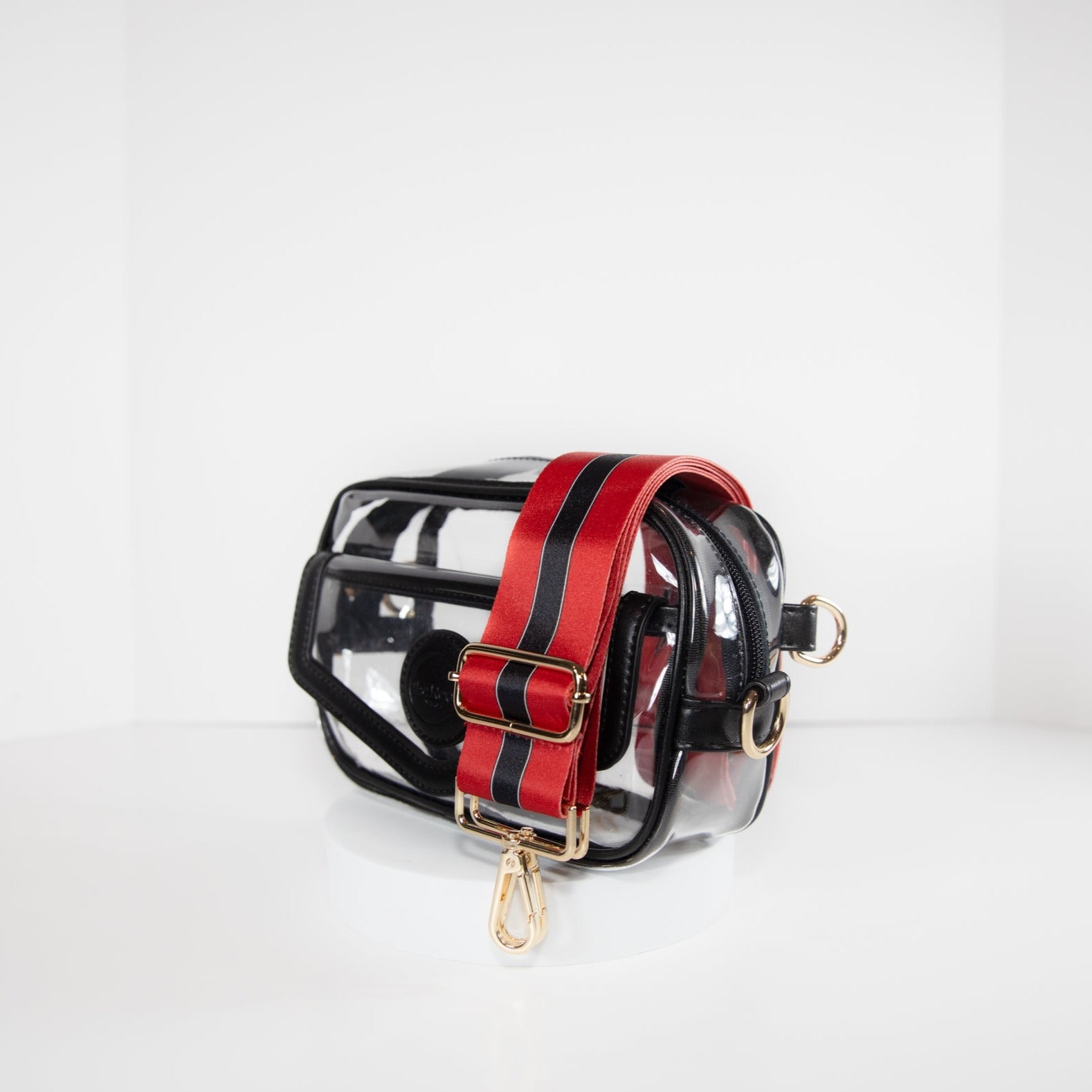 Clear stadium bag with black leather trim, side facing, with a crossbody strap in team colors of the Georgia Bulldogs.