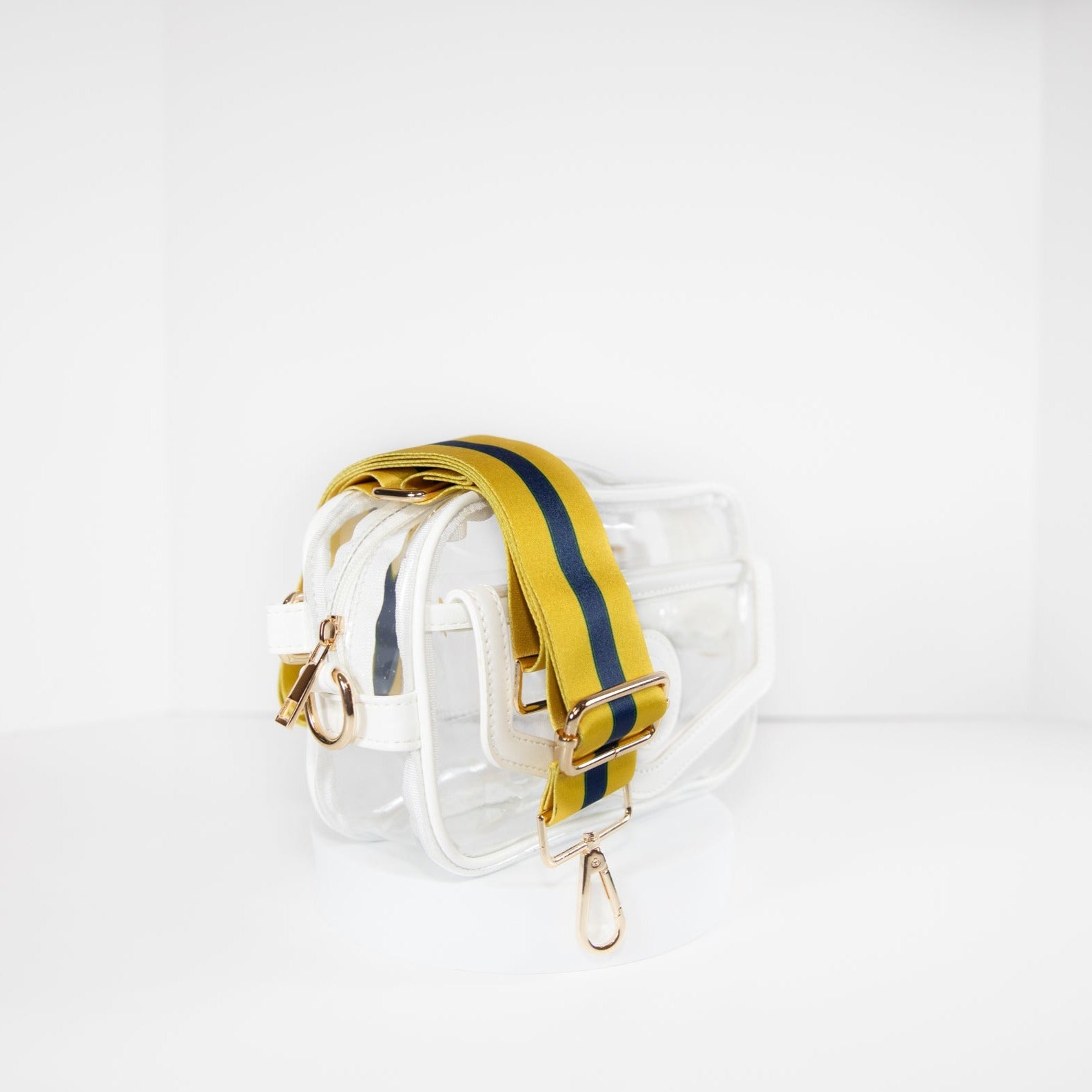 Clear stadium bag in white leather trim, side facing, with a crossbody strap in Notre Dame Fighting Irish team colors.