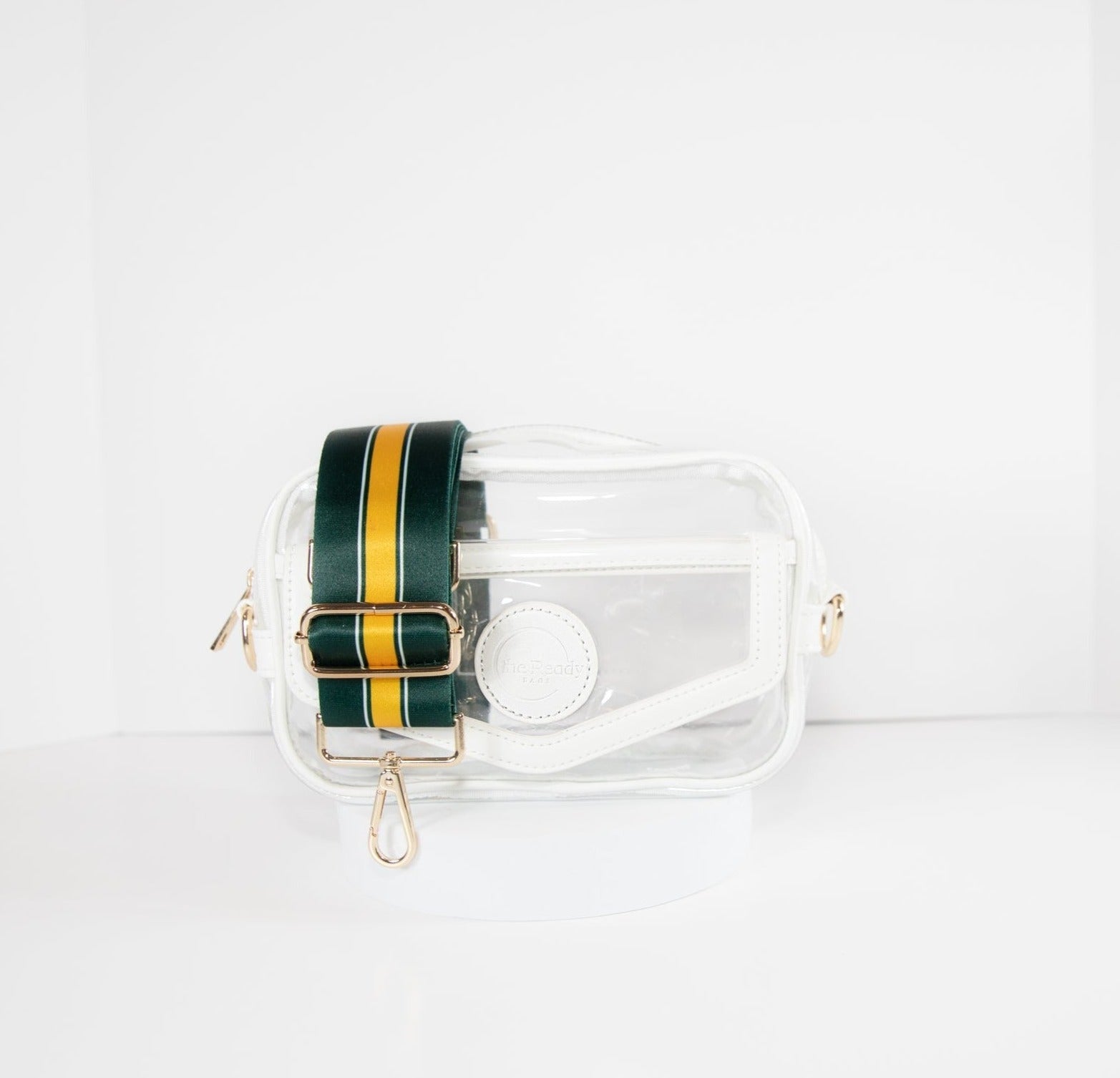 Clear Stadium Bag in white leather trim, front facing, with a strap in the team colors of the Green Bay Packers.