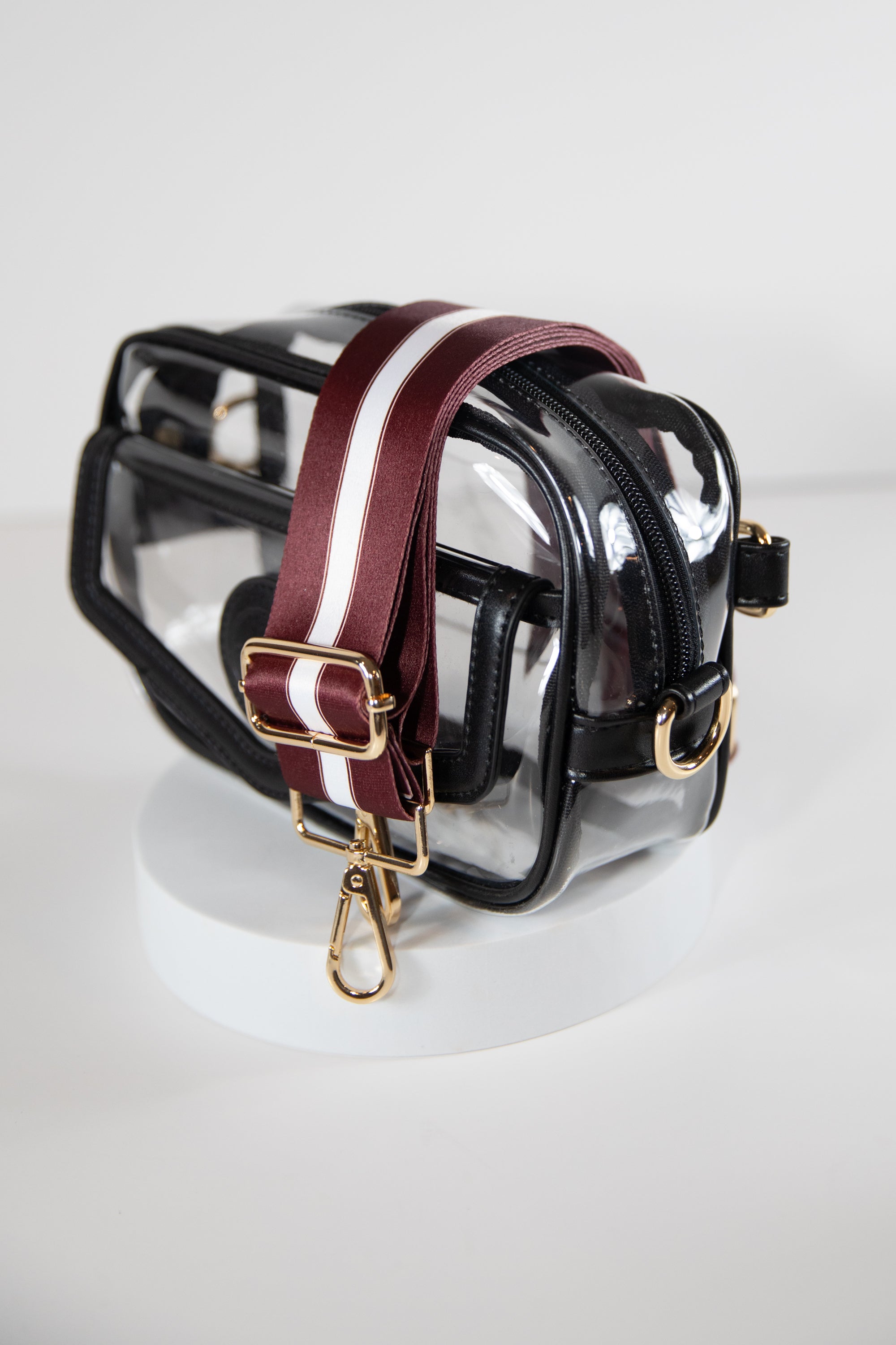 Clear stadium bag in black leather trim, side facing, with a crossbody strap in the team colors of Texas A&M.